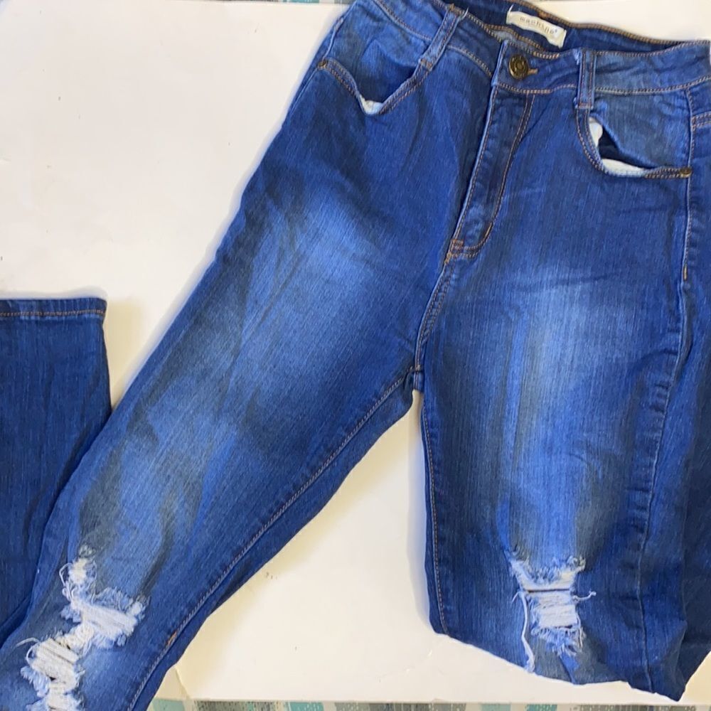 Machine distressed jeans  
